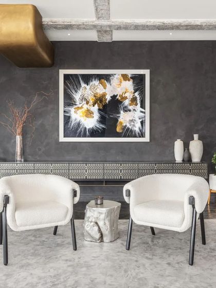 This New York apartment features my custom-designed Laila Sideboard in pyrite and black resin, an avant-garde twist on a classic design. It is paired with my comfortable and durable Boho Chairs, upholstered in a white bouclé fabric.