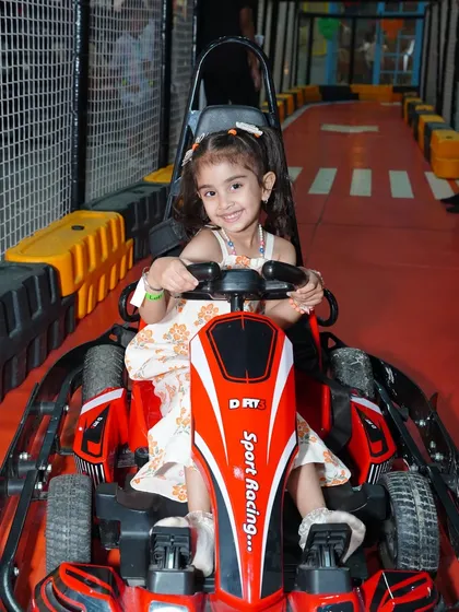 A young girl in a pretty dress is ready to race in her red go-kart. Our activities are designed for all kids to enjoy.