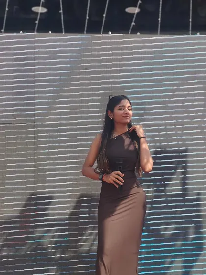 A profile shot against the stage backdrop from the same UK event. Being a destination wedding host means being ready to bring my A-game anywhere in the world.