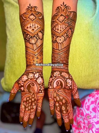 A semi-bridal design featuring peacocks and geometric patterns. It's a great option for those who want an intricate look without full coverage.