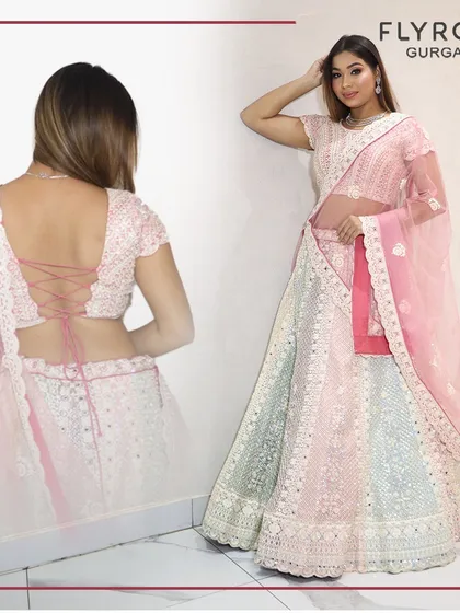 This multi-colored pastel lehenga with a unique tie-back blouse is a work of art. It's perfect for the fashion-forward woman who loves to experiment with her style.