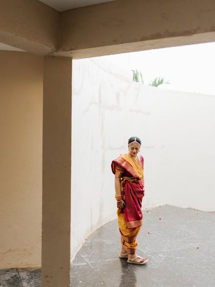 A wide shot showing the bride in her traditional nine-yard drape, a testament to my expertise in cultural styling.