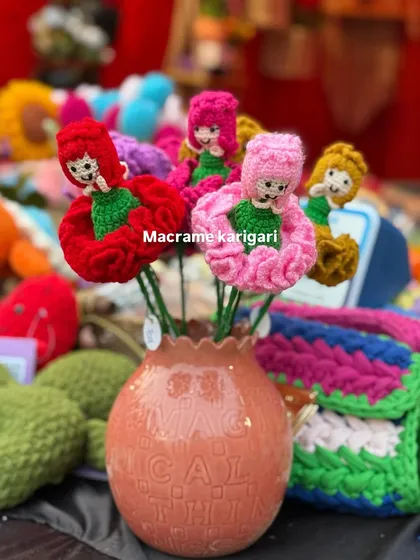 Our whimsical carnation dolls, which combine a flower with a cute little doll figure. These are a playful and unique creation that kids and adults love.