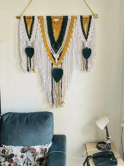 We love seeing our creations in their new homes. A client sent us this picture of our three-panel macrame wall hanging, and the way it complements their living room decor is just perfect.
