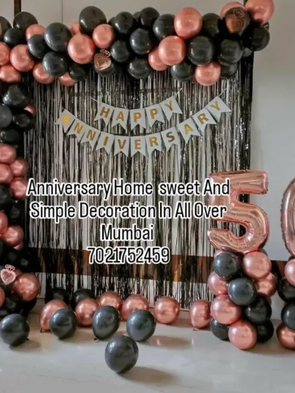 This 50th anniversary decoration shows a popular color combination of rose gold and black. We built a rectangular balloon arch over a shiny foil curtain, added a "Happy Anniversary" banner, and included large foil numbers to celebrate the golden anniversary in style. This setup is perfect for home parties.