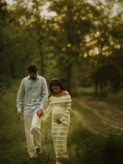 "We haven't met yet, but I've loved you forever." This image of the couple walking through a sun-dappled forest path perfectly captures the feeling of loving someone before they've even arrived.