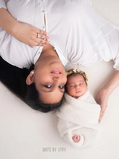 A mother and daughter portrait, showing the beginning of a lifelong bond.