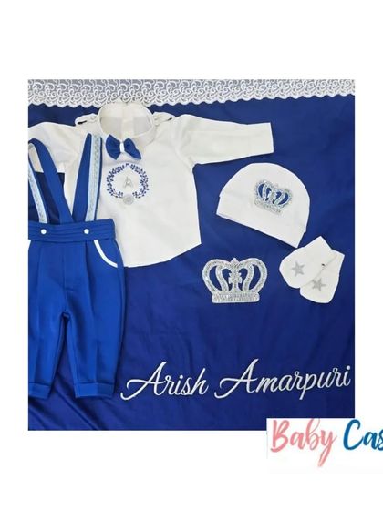 A personalized set for a little prince named Arish. This royal blue and white outfit includes a bodysuit with suspenders, a matching cap, and a swaddle sheet with his full name.