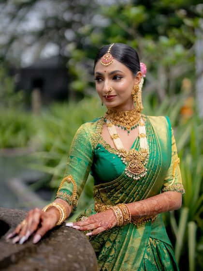 This bride's look features a beautiful balance of traditional elements. The makeup highlights her features without being overpowering, letting her natural beauty shine through.