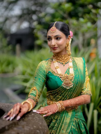 This bride's look features a beautiful balance of traditional elements. The makeup highlights her features without being overpowering, letting her natural beauty shine through.