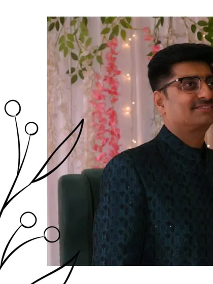 Ethnic elegance for every man. This guest looks sophisticated in a dark green patterned jacket, perfect for attending a wedding reception.