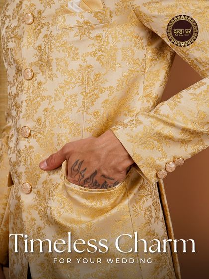 Timeless charm for your wedding. This close-up of a golden brocade jacket reveals the rich floral pattern and the luxurious texture of the fabric.