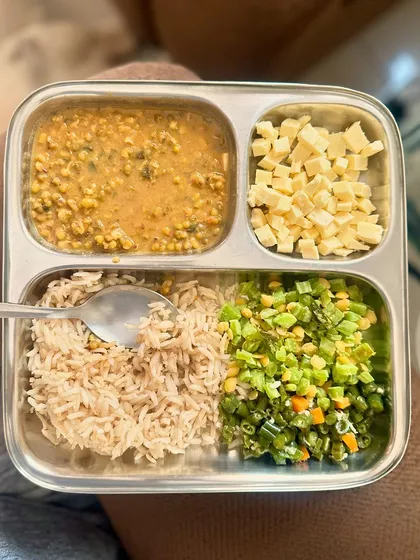 A simple plate of brown rice, moong dal, and cubed cheese. Sometimes, a simple meal is all you need to stay on track with your health goals.