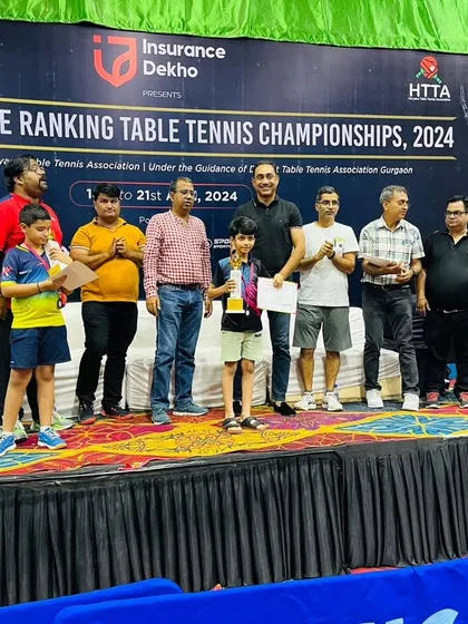 Keshava Vasudev on stage receiving his bronze medal. This recognition at a young age is a great confidence booster and a key milestone in his development as a table tennis player.