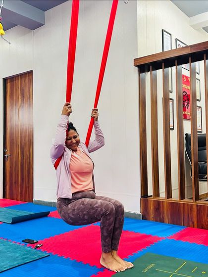 The simple act of sitting and swinging in the hammock can be incredibly joyful. Our classes are not just about the poses, but also about finding moments of playfulness and release.