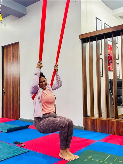 The simple act of sitting and swinging in the hammock can be incredibly joyful. Our classes are not just about the poses, but also about finding moments of playfulness and release.