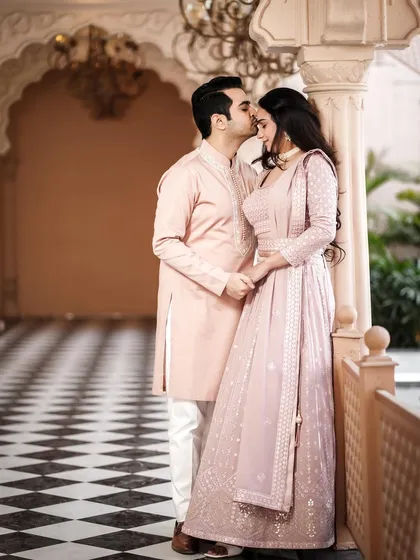 A tender moment in a beautiful hallway. The groom's kiss on the forehead is a classic romantic gesture that I love to capture.
