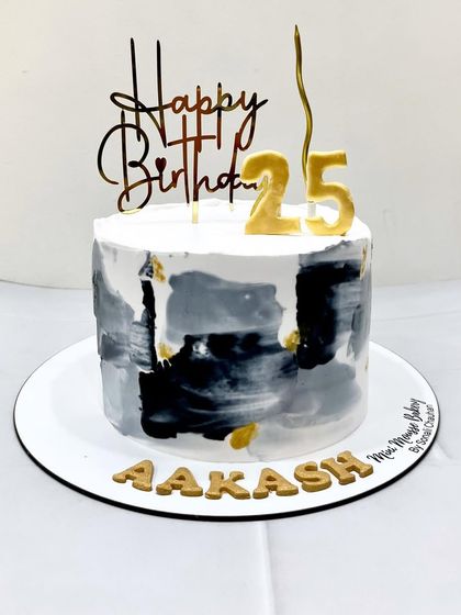 A different view of the black and grey painted cake. This style is very popular for men's birthdays and sophisticated celebrations.