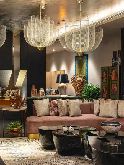 The formal living room of the Bammi Residence, featured in Living Etc. India. The space is a microcosm of light, life, and artistry, filled with one-of-a-kind masterpieces from across India.