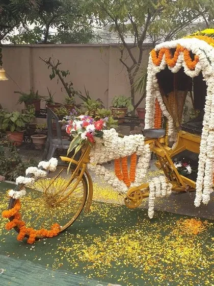 Why have a simple backdrop when you can have a fun, interactive photo booth? This vintage cycle rickshaw, fully decorated with marigold and jasmine garlands, was a huge hit at a mehendi ceremony, adding a touch of quirky charm and creating lots of smiles.