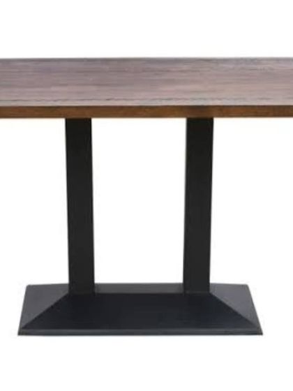 This rectangular cafeteria table features a sturdy double-pedestal base, providing extra stability for larger groups. The dark wood finish is durable and suitable for high-traffic dining areas.