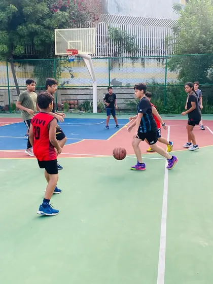 A player dribbles the ball against a defender.
