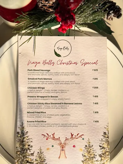 Our special menu for Christmas, featuring festive dishes like Pork Blood Sausage, Smoked Pork Momos, and Axone Fried Rice. We love creating unique menus for holidays.