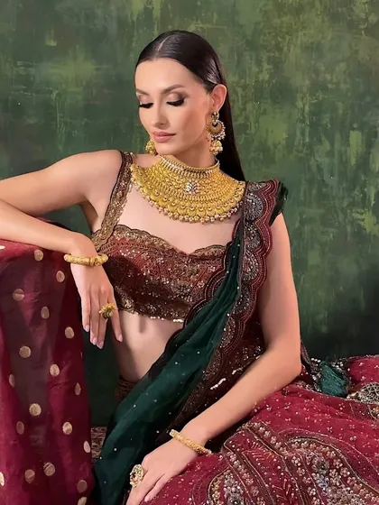 A beautiful final portrait from the jewelry campaign. The makeup is soft yet defined, designed to enhance the model's natural beauty while allowing the stunning gold jewelry to be the star of the show.