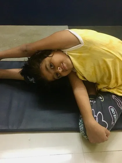 Another young student showing great progress in Parivrtta Janu Sirsasana.