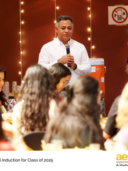 The High School Principal speaks to graduating seniors about the importance and benefits of joining the alumni network.