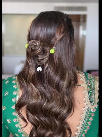 Another angle of the creative Dandiya hairstyle, showing the combination of braids, a bun, and fun accessories.