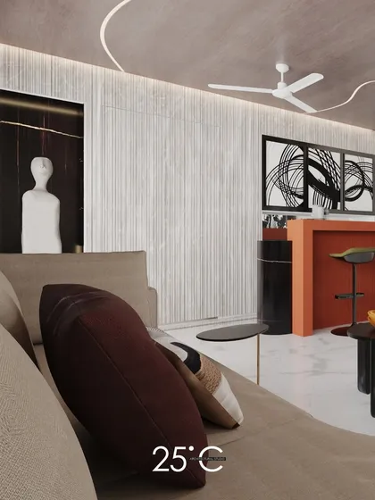 This view showcases the open-plan living area with a bold, rust-colored bar counter that adds a pop of color. The space is unified by marble flooring and a cohesive palette of neutral tones and modern art.