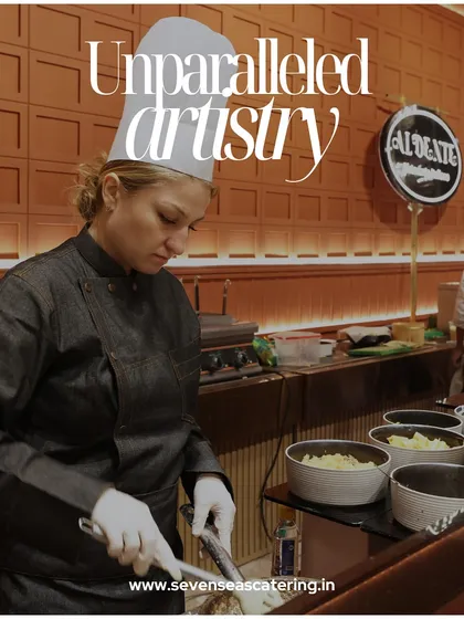 Unparalleled artistry. A female chef, focused and precise, prepares a dish at a live station, embodying the skill and dedication of my international team.