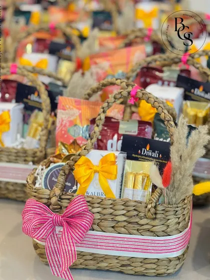 These festive baskets are overflowing with treats and tied with bright, cheerful ribbons, ready to be sent out for Diwali. I specialize in handling large festive orders, ensuring each hamper is a delightful surprise for the recipient.