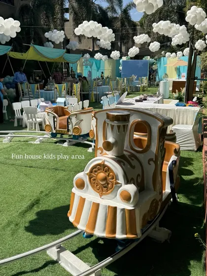 All aboard the fun express! Our white and gold kids' train ride is a magical addition to any party, providing endless entertainment. It's a fantastic centerpiece for outdoor events and a guaranteed hit with children of all ages.