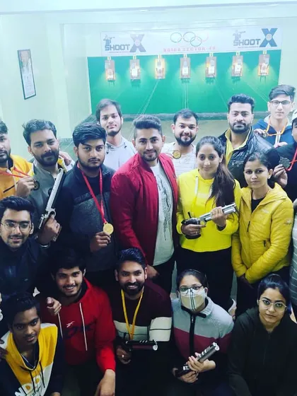 Celebrating our champions together. Here is our team with Sumit, celebrating his gold medal win. We believe in recognizing every victory, big and small, as a family.