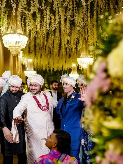 The groom's grand entrance with his friends and family, full of dancing and energy.
