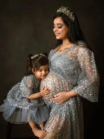A beautiful moment as an older sister connects with her new sibling on the way. I love including the whole family in maternity sessions to celebrate this special time of transition.