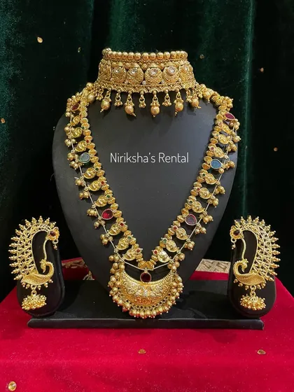 This gold-finish set with peacock earrings and multi-colored stones is another versatile rental option for weddings and festivals.