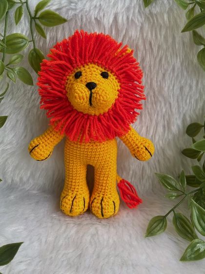 A vibrant version of the Lion King, Simba! This one has a bright yellow body and a fiery orange mane, making him look just like the character from the movie.