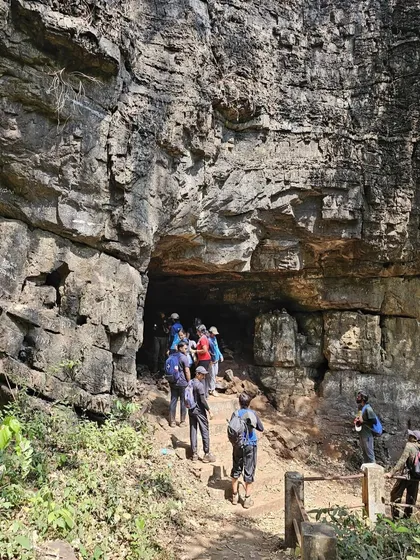 The group entering the mouth of a large cave, ready for exploration.