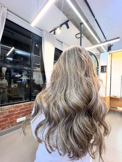 This ash blonde is a very popular choice for a modern, cool look. The light, silvery tones are perfect for those with cooler skin tones.