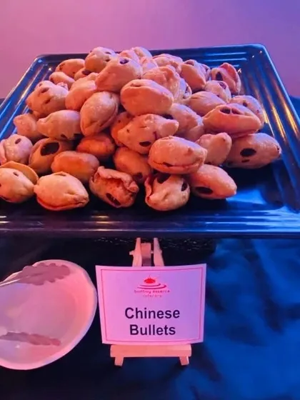 These are our Chinese Bullets, a unique and savory fried appetizer with an Asian-inspired filling. They are a great addition to any starter menu for a touch of fusion flavor.