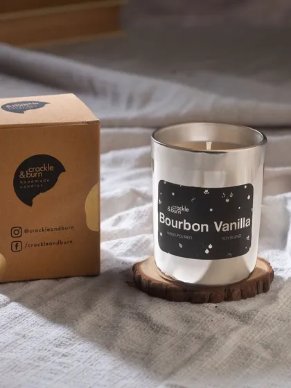 My Bourbon Vanilla scented candle in a simple, elegant silver glass. It comes in a branded box, making it an easy and sophisticated last-minute gift.