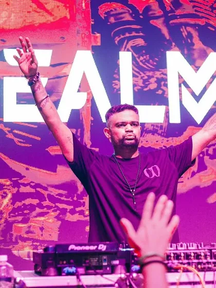 With my name on the screen and hands in the air, this is me in my purest form. It's a moment of total connection, feeding off the crowd's energy and giving it right back. This is the Realmm experience.