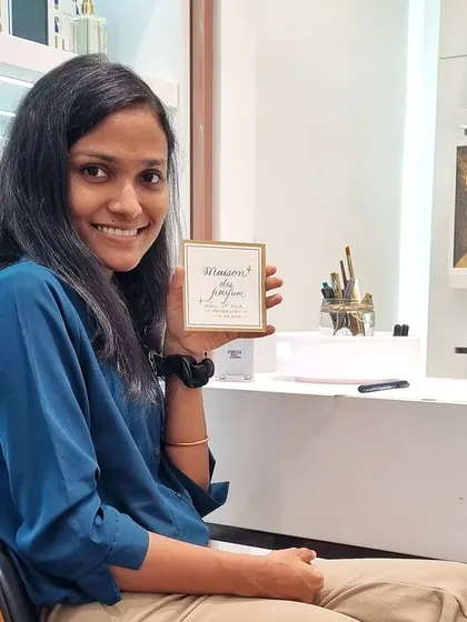 A happy moment holding a finished piece at the Maison Des Parfums Valentine's event. Seeing a guest's delight with their custom note is the best part of any on-site activation.