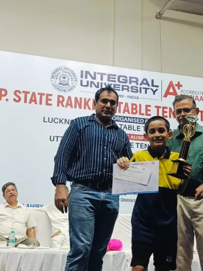 Our U-11 Boys champion, Aryaveer Borah, with his trophy and coaches at the UP State Ranking Tournament.