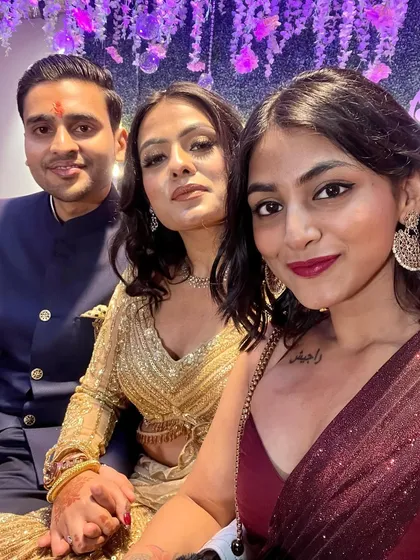 A sweet moment captured with friends at a wedding. It's all about celebrating together in our finest festive wear.
