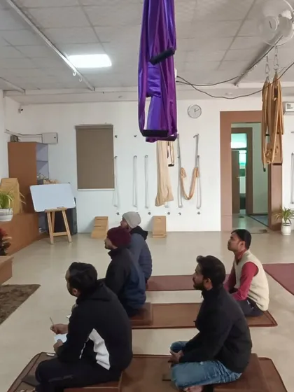 Students at our free Sunday workshop for yoga teachers, listening with focus and dedication. The space is designed to be calm and conducive to deep learning, with all necessary props available.