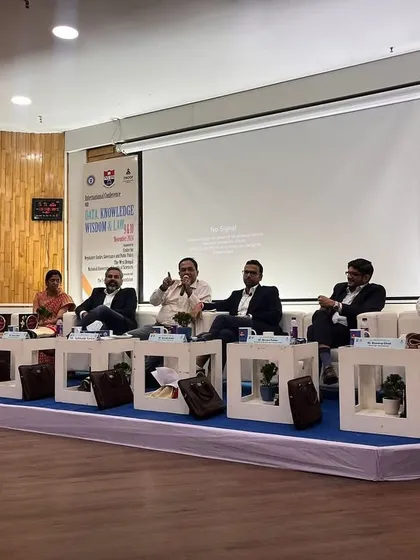 A wide view of the stage during the conference on Data, Knowledge, Wisdom and Law, where our partner led a discussion on data governance and public policy.